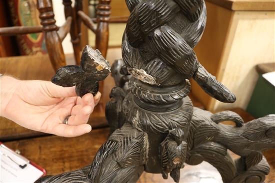 A carved tripod table W.55cm